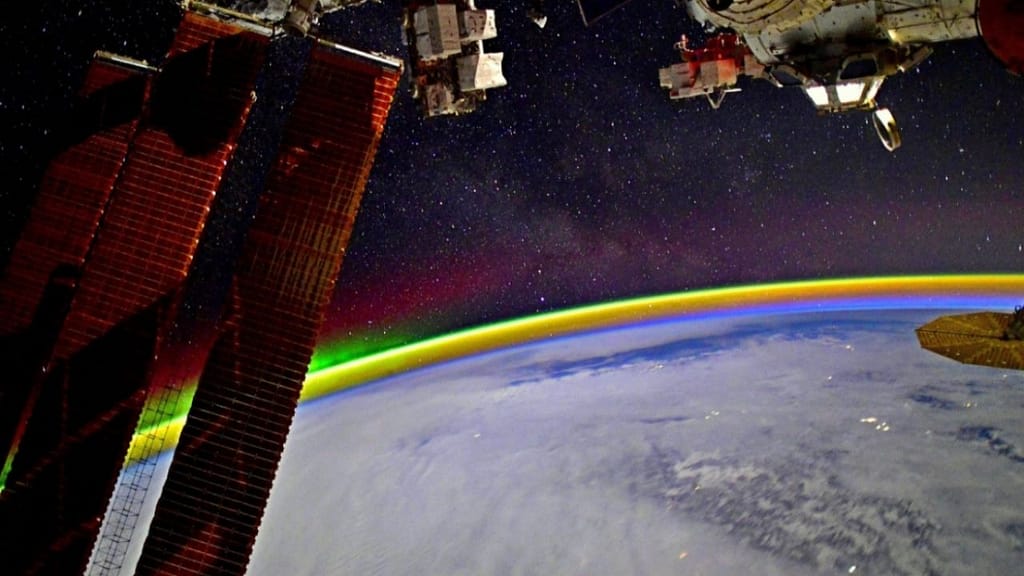 Gorgeous!  An astronaut captures a rainbow in space near the Earth