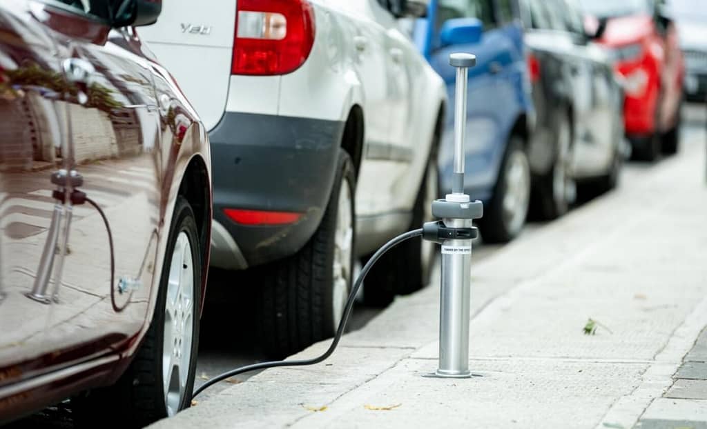 In the UK they are already using electric car chargers under sidewalks that are activated by a switch |  engine