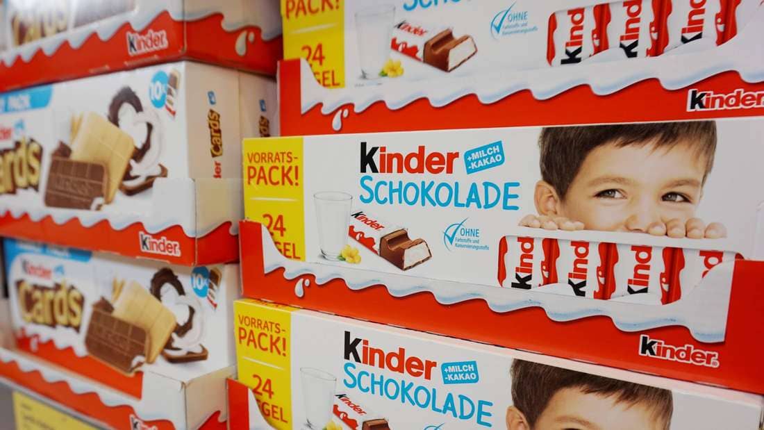 Kinder chocolate packets on a supermarket shelf.