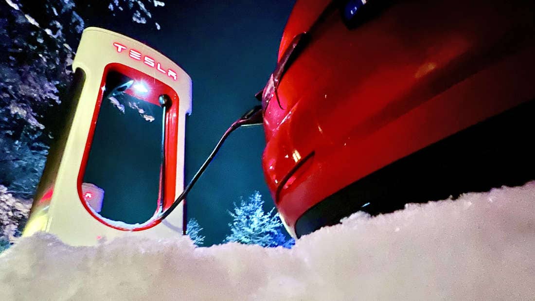 Tesla in a fast charging station in the snow (avatar)