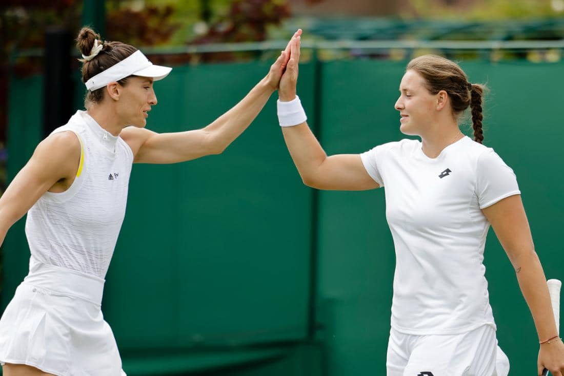 Tennis players Andrea Petkovic and Jules Niemeyer top five fifth during a doubles match at Wimbledon.