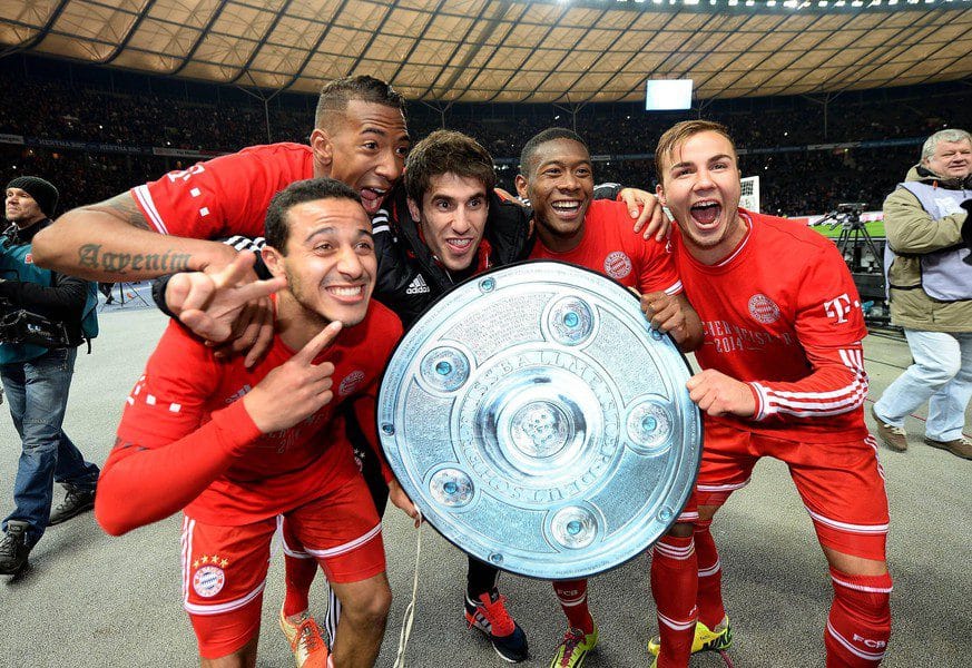 Jerome Boateng (second from left) celebrates the 2014 German Championship with former teammates Thiago (from left), Javi Martinez, David Alaba and Mario Gotze.