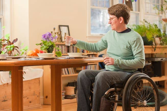 A patient in a wheelchair due to multiple sclerosis.