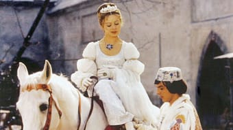 Prince (Pavel Travnisk) adjusts Cinderella (Lebus Safrankova) the missing shoe in a scene from the movie 
