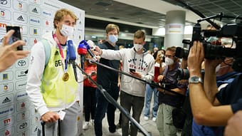German tennis player Alexander Zverev speaks to media representatives after arriving from Tokyo to Frankfurt Airport.