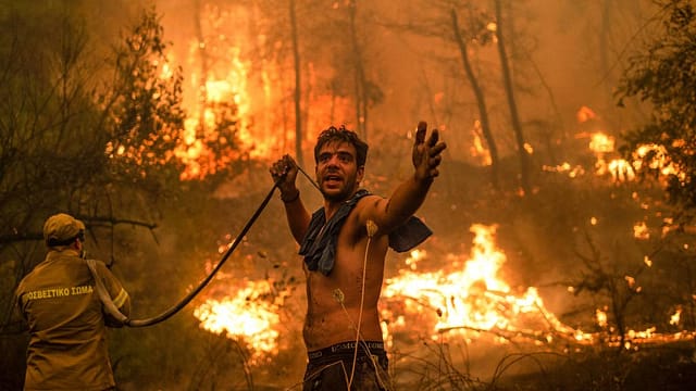 Greece's wildfires: In tears and despair, thousands are evacuated