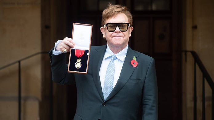 Presented by Prince Charles: Elton John Receives High British Honor

