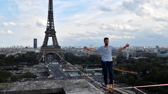 High-wire artist balances over the Seine from the Eiffel Tower

