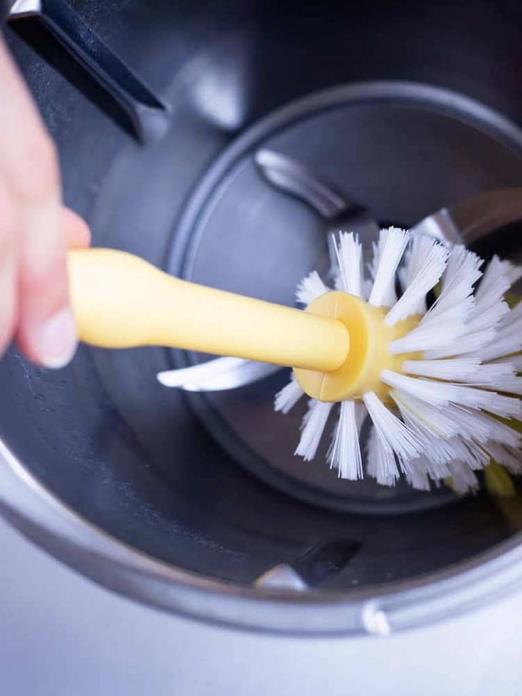 Use a soft-bristled bottle brush and clean the Theromix cooker bowl