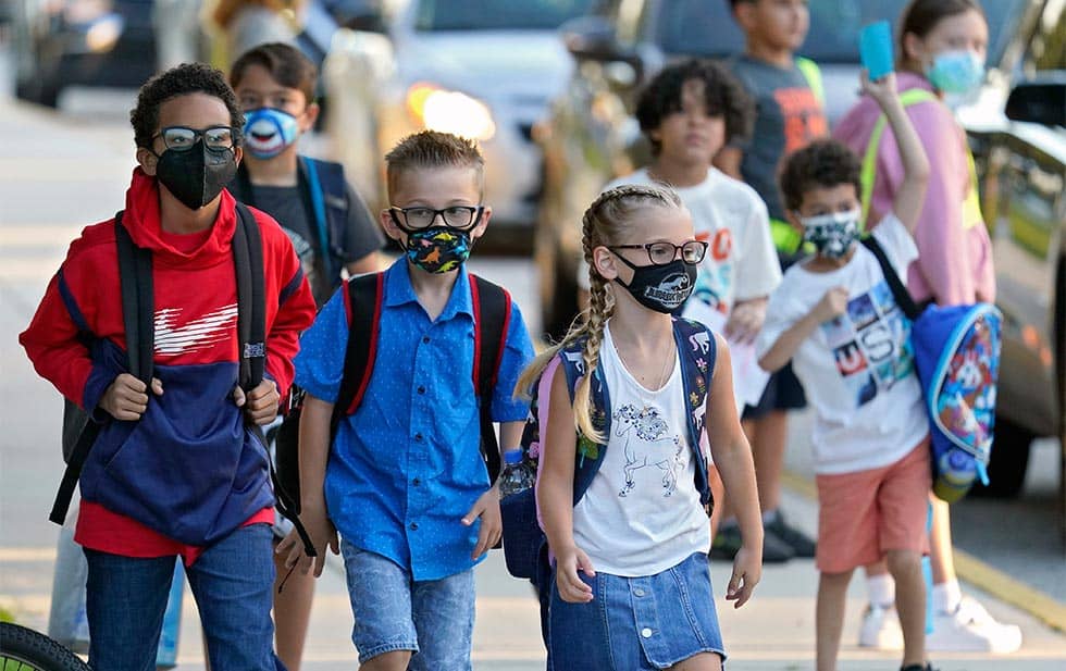 Biden calls on school administrators to defy anti-mask rules