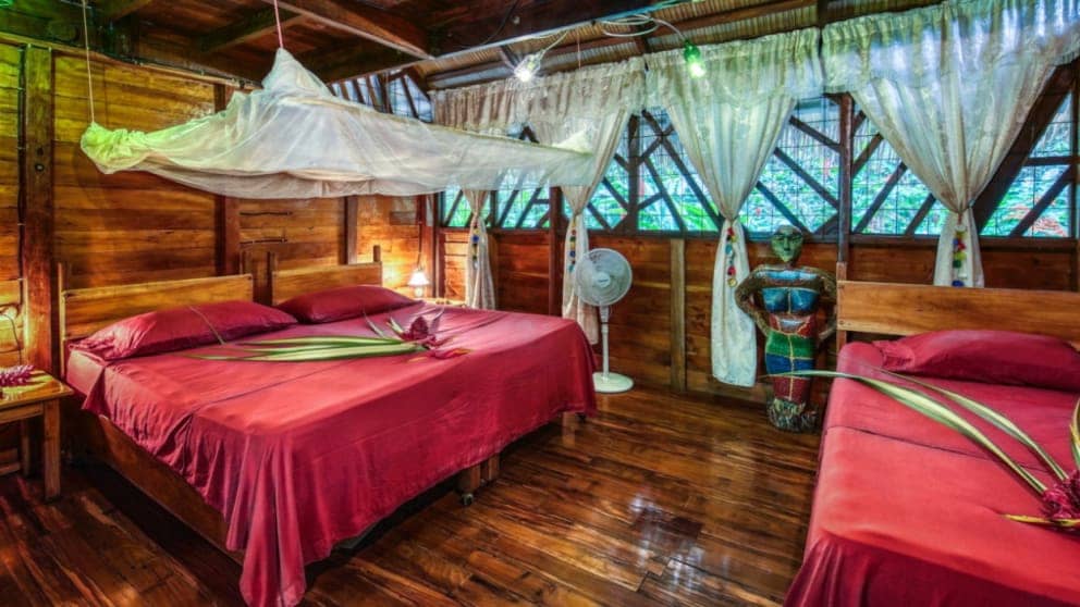 Mosquito nets can be lowered over the large beds on the elegant wooden floor