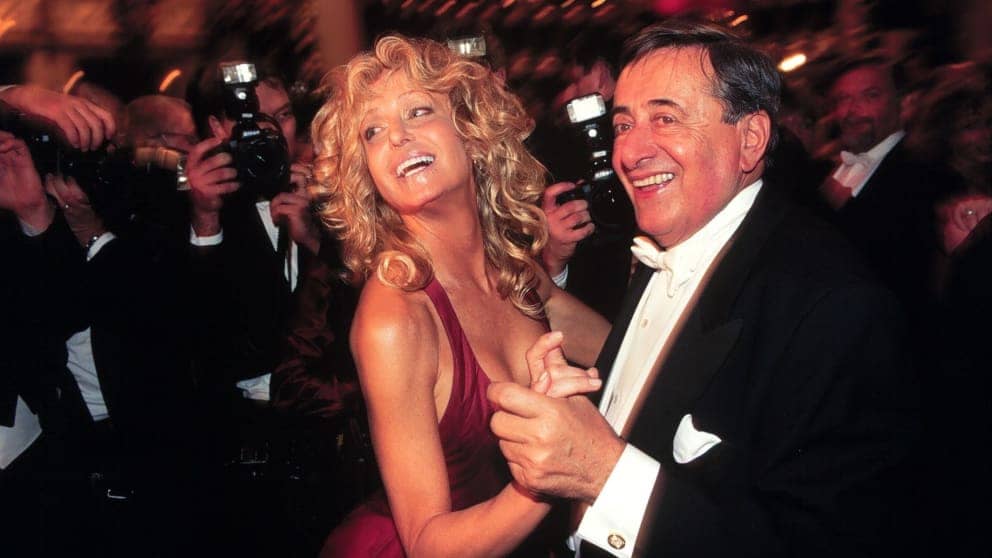 In 2001, Farrah Fawcett (then 54) was a guest at the opera ball box for Richard Lugner (68).  She brought up her son Redmond (16), who was said to have been very impressed with Lugner's then-wife Christina (35).