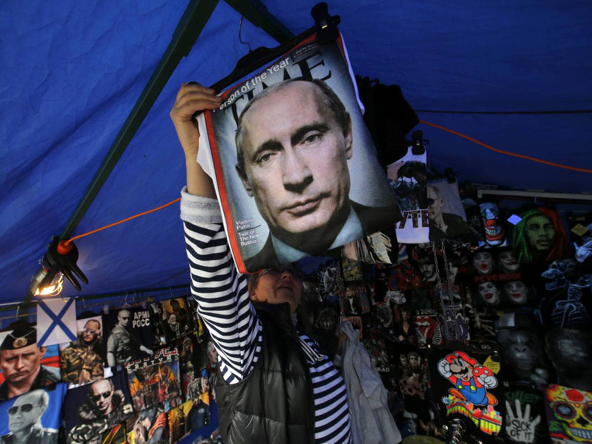 Photo: A Putin-faced shirt seller in St. Petersburg on August 31, 2014, after the outbreak of war in eastern Ukraine.  (Reuters)