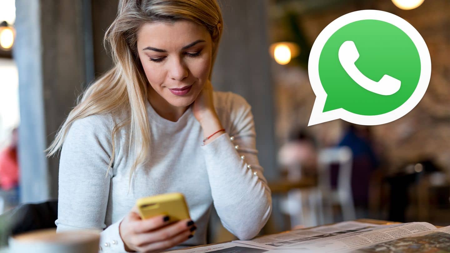 Woman with cell phone, whatsapp logo