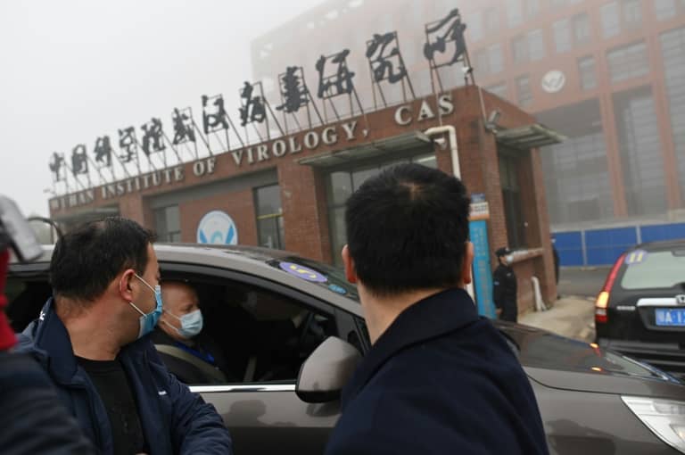Members of the WHO team working on the origins of Covid-19 arrive at the Institute of Virology in Wuhan, China on February 3, 2021 (AFP / ARCHIVES - HECTOR RETAMAL)
