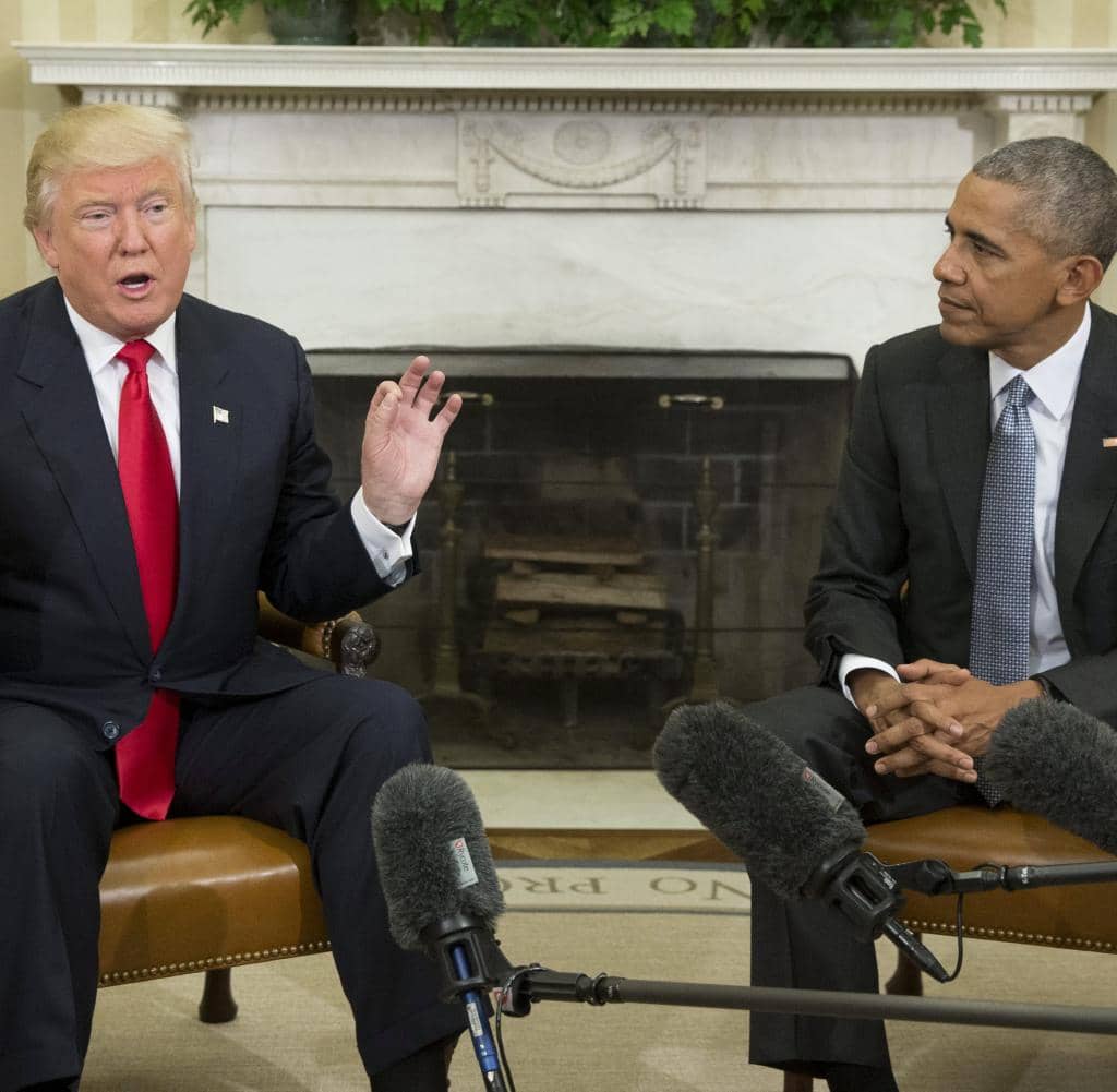 Barack Obama (right) hands over to Donald Trump