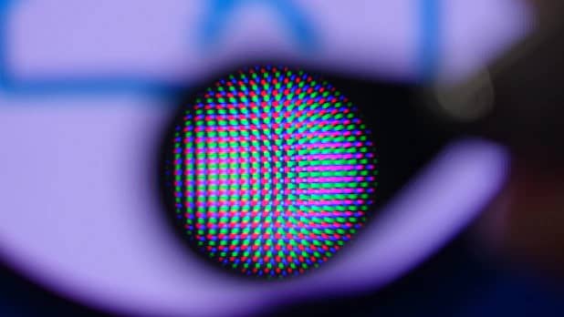 Blue OLEDs and the red and green quantum dots excited with them are clearly visible under the magnifying glass